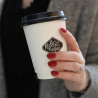 Custom printed white biodegradable paper cup with black lid with 'Kolonihagen' logo